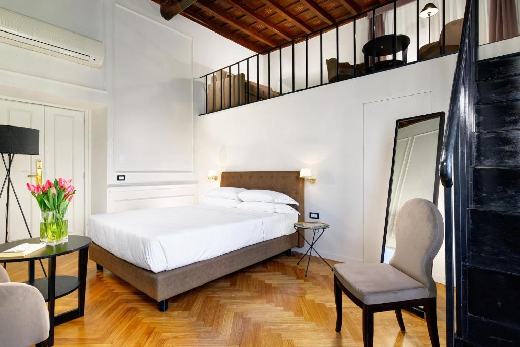 A bed or beds in a room at Splendor Suite Rome - Suites & Apartments