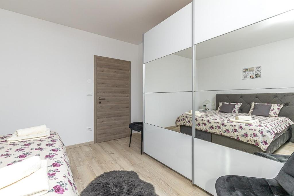 Posteľ alebo postele v izbe v ubytovaní Holiday House Sunrise