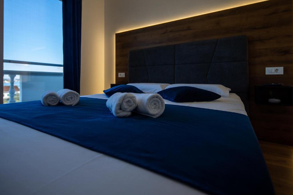 Postel nebo postele na pokoji v ubytování Apartman Sailor