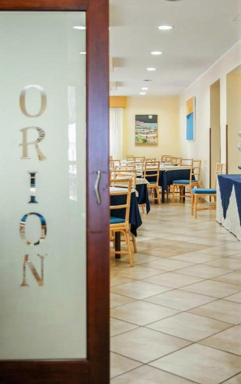 A restaurant or other place to eat at Hotel Orion