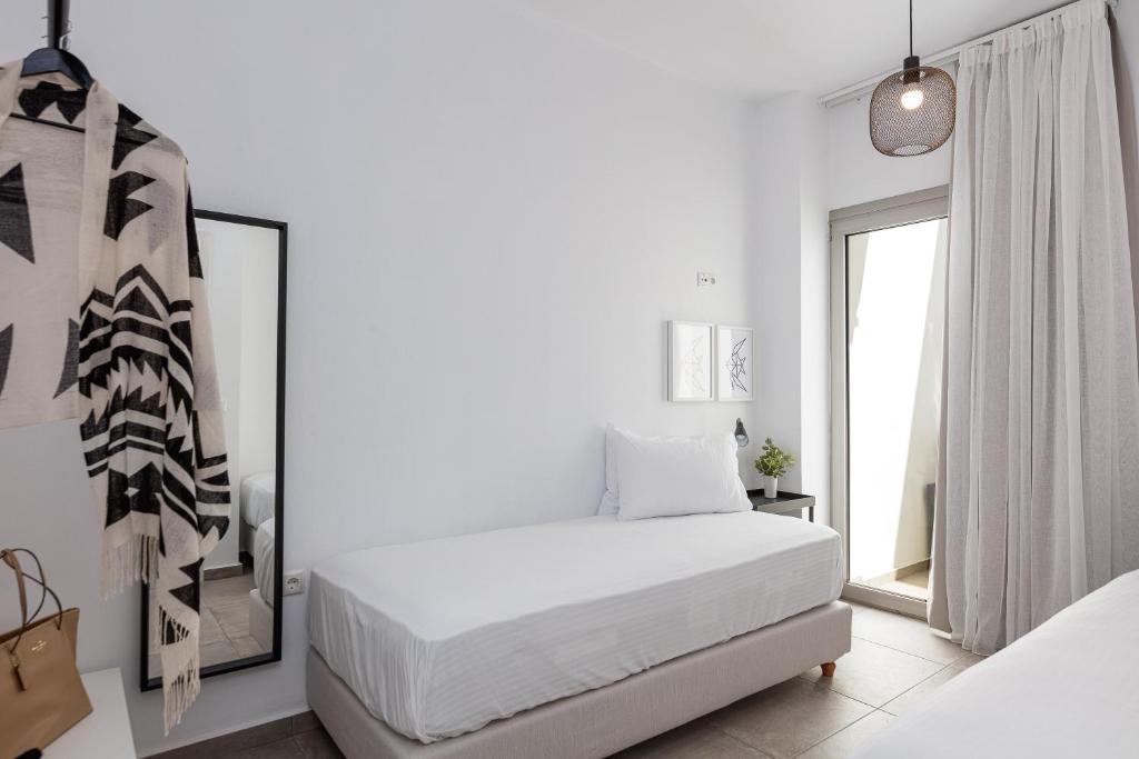 Posteľ alebo postele v izbe v ubytovaní Aelia Seascape Apartments