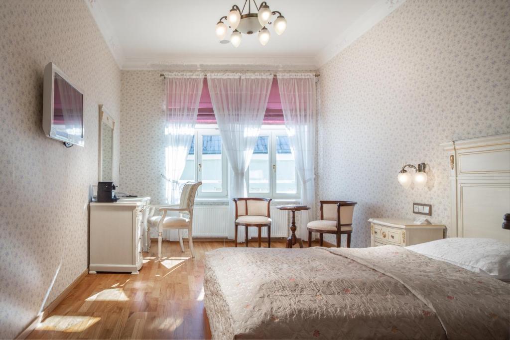 Postel nebo postele na pokoji v ubytování Spa Hotel Schlosspark