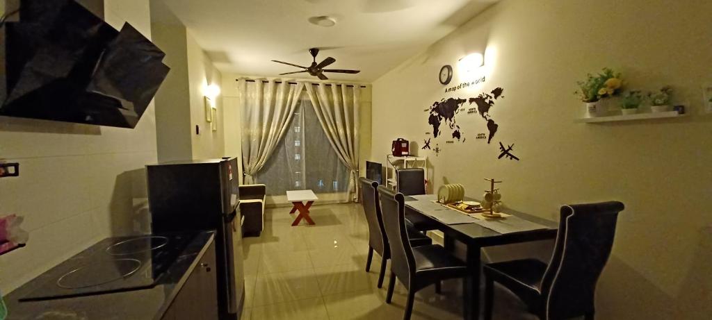 a kitchen with a table and chairs in a room at HOMESTAY ARC @ AUSTIN HILLS JB in Johor Bahru