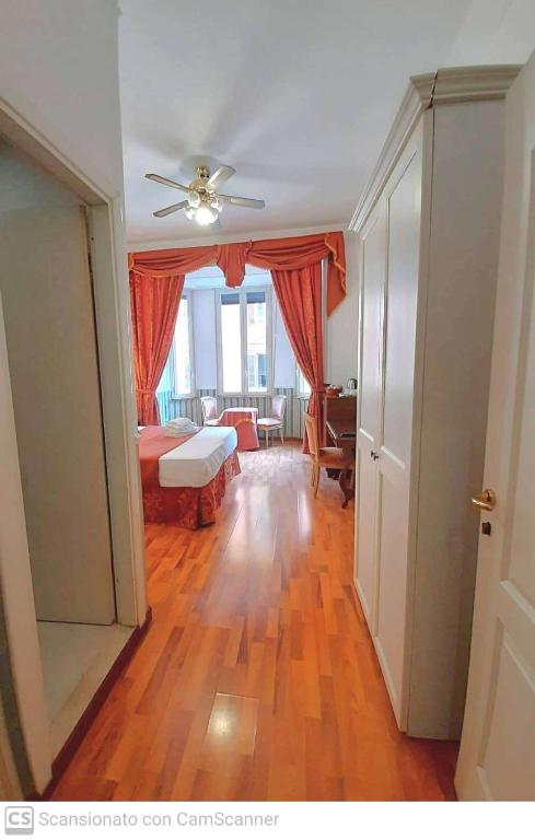 Postel nebo postele na pokoji v ubytování Hotel Porta Pia