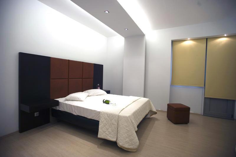 Łóżko lub łóżka w pokoju w obiekcie INOH HOTEL