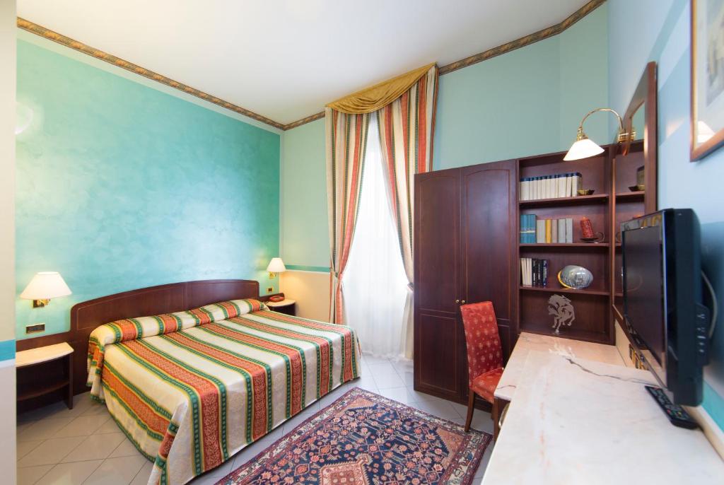 TV a/nebo společenská místnost v ubytování Hotel Londra