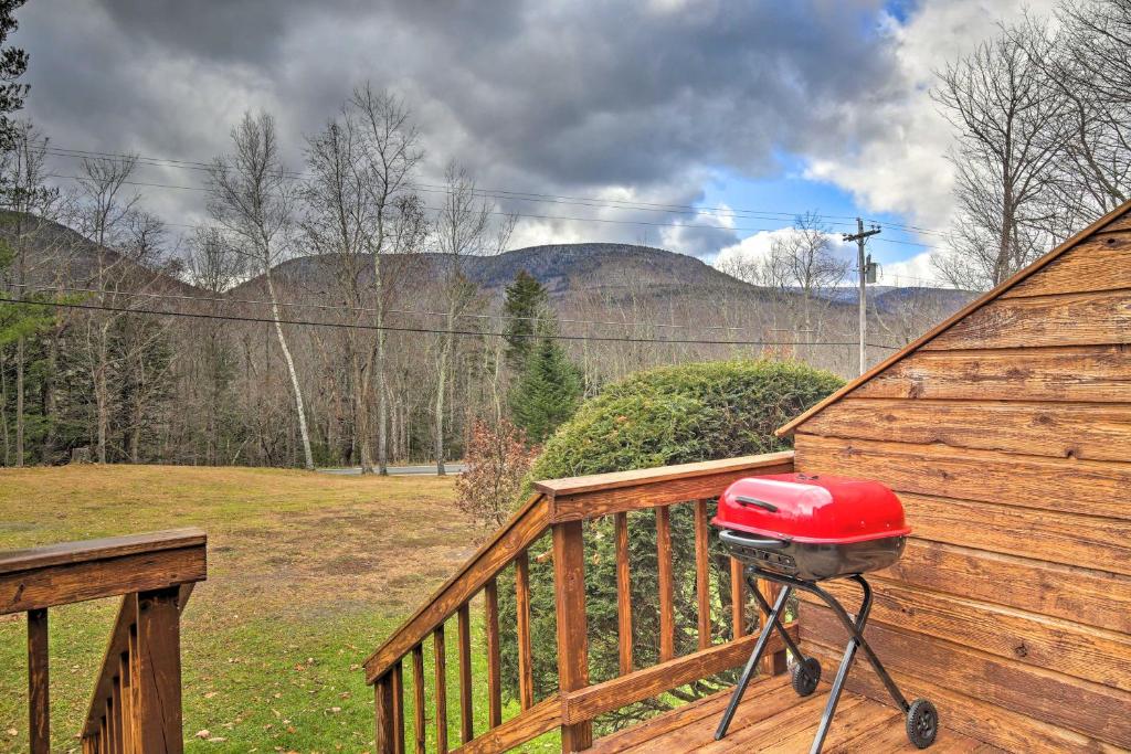a grill sitting on a wooden deck on a porch at Elka Park Townhome with Views about 5 Mi to Skiing! in Elka Park