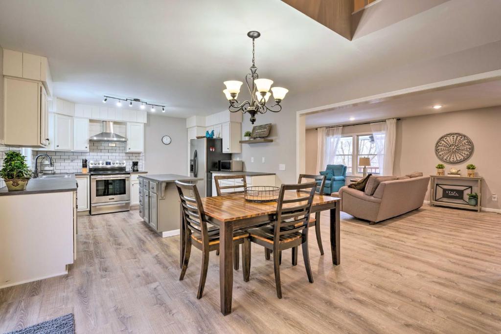 a kitchen and dining room with a table and chairs at Hilltop Home Inside of Apple Valley! in Mount Vernon