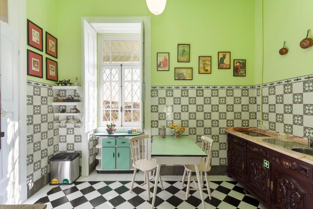 A kitchen or kitchenette at Vintage Balcony Guesthouse