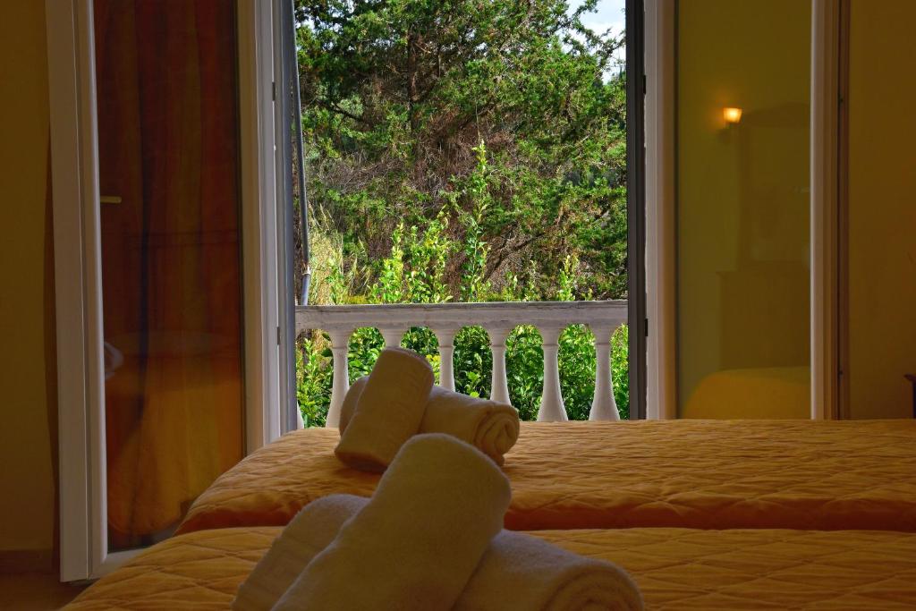 Кровать или кровати в номере Delfini Resort