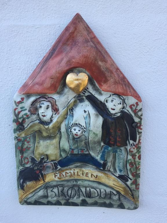 a painting of a family in a triangle at Brøndums Bed & Breakfast in Hjørring