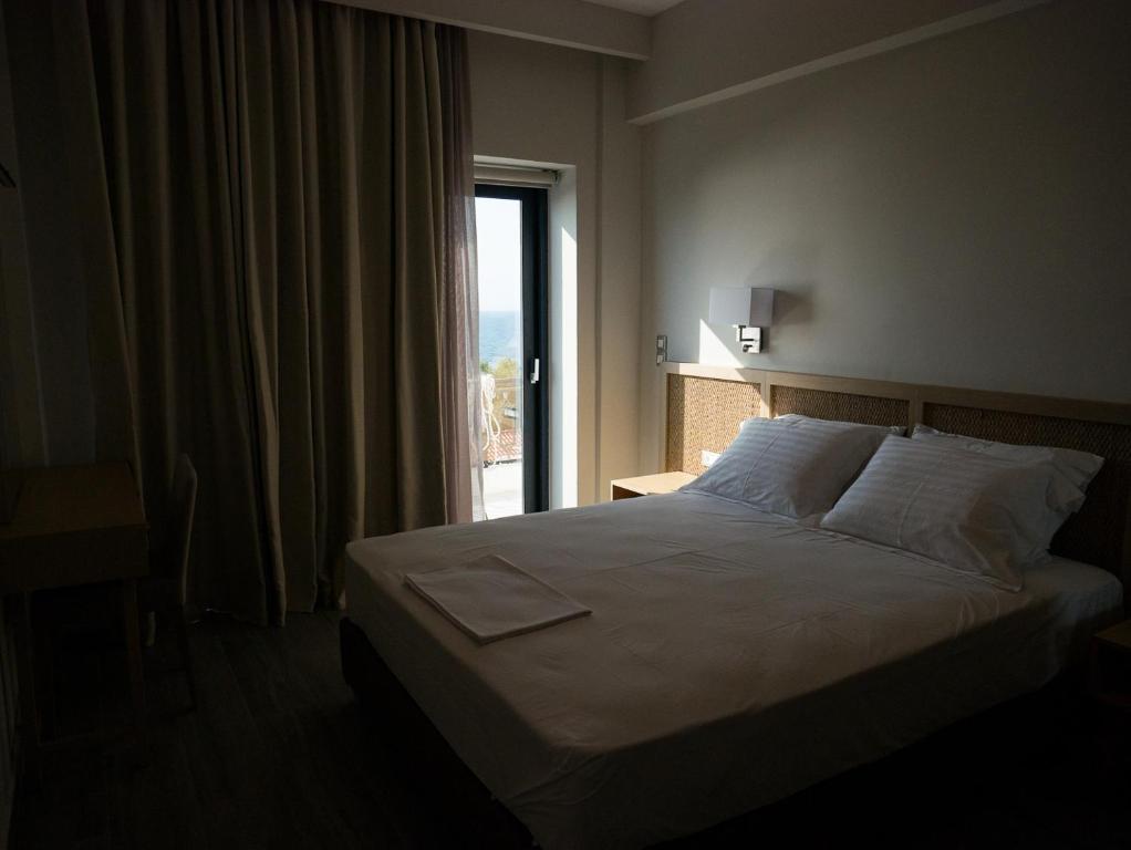 Posteľ alebo postele v izbe v ubytovaní Elegant Beach Hotel