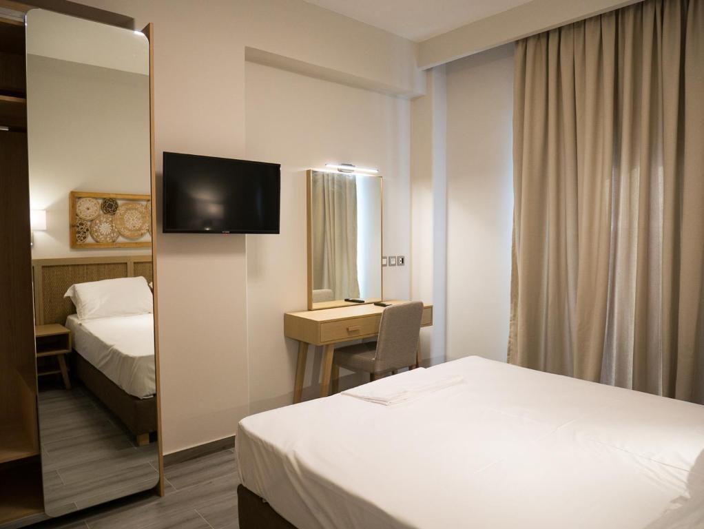 Posteľ alebo postele v izbe v ubytovaní Elegant Beach Hotel