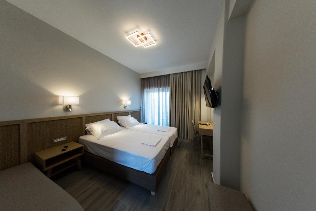 Posteľ alebo postele v izbe v ubytovaní Elegant Beach Hotel