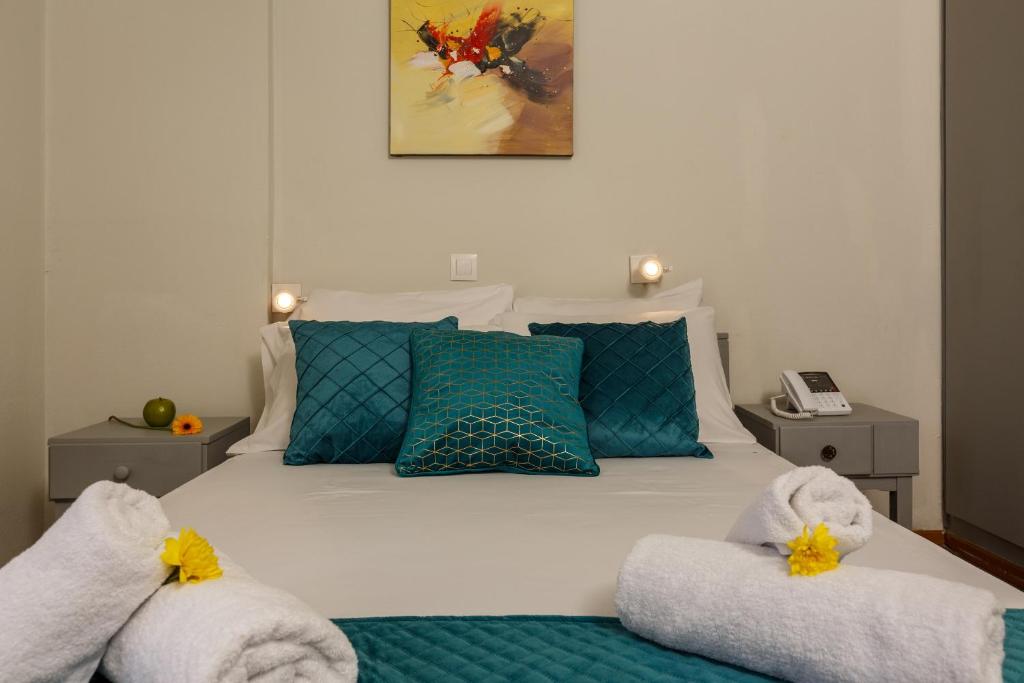 A bed or beds in a room at Asterion Hotel