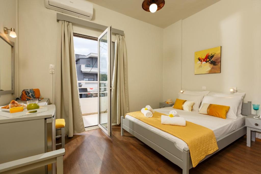 A bed or beds in a room at Asterion Hotel