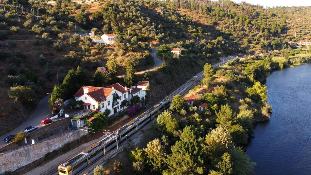 an aerial view of a house next to a river at A Saboeira - Turismo Rural in Belver