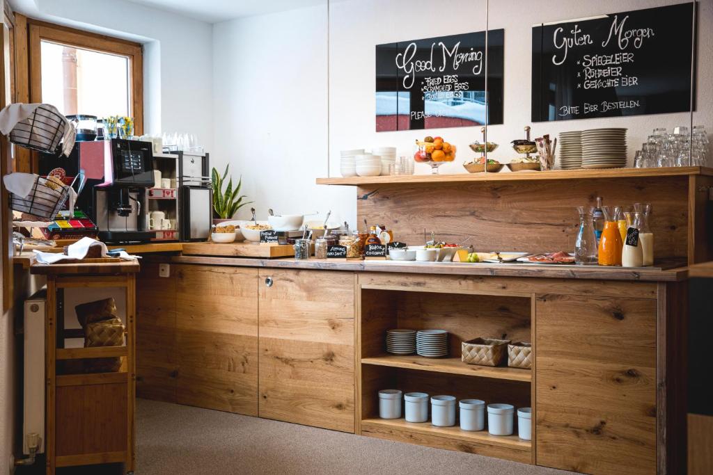 a kitchen with a counter with food on it at Hotel Montfort in Sankt Anton am Arlberg