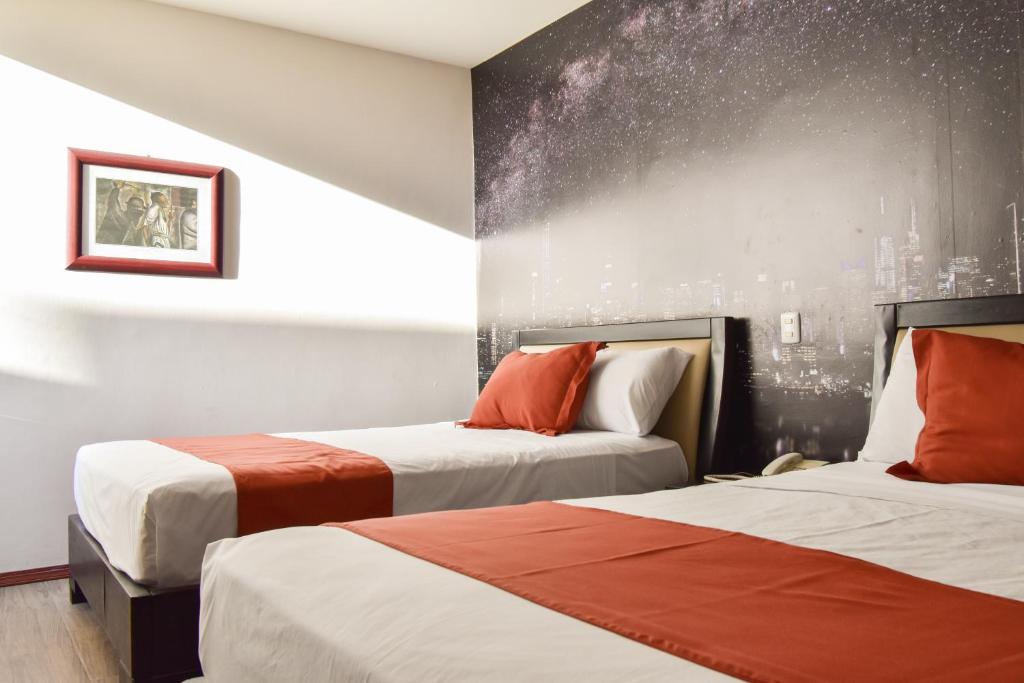 Voodi või voodid majutusasutuse Hotel TÖTEM Guadalajara toas