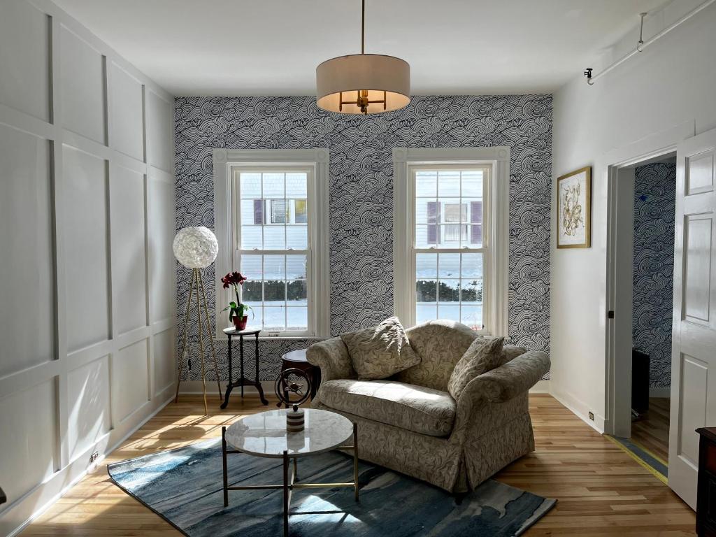 a living room with a couch and a table at Queen Anne's Revenge in Bar Harbor