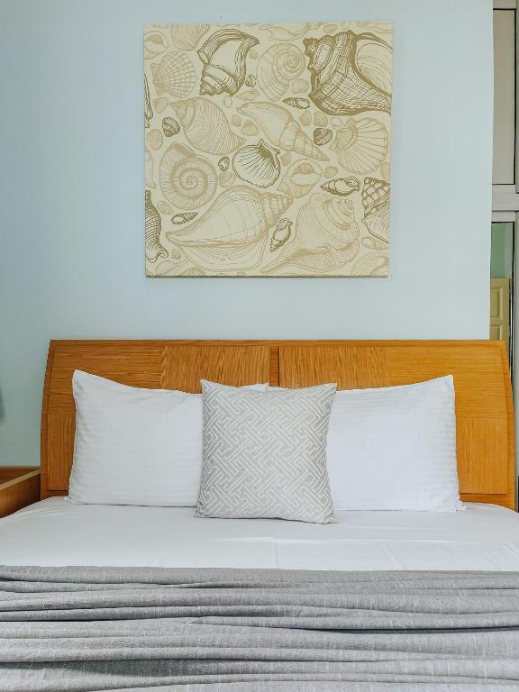 Postel nebo postele na pokoji v ubytování Vithos Seaside Aparthotel