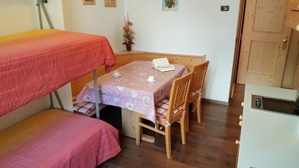 Postel nebo postele na pokoji v ubytování Hotel Garni Arnica
