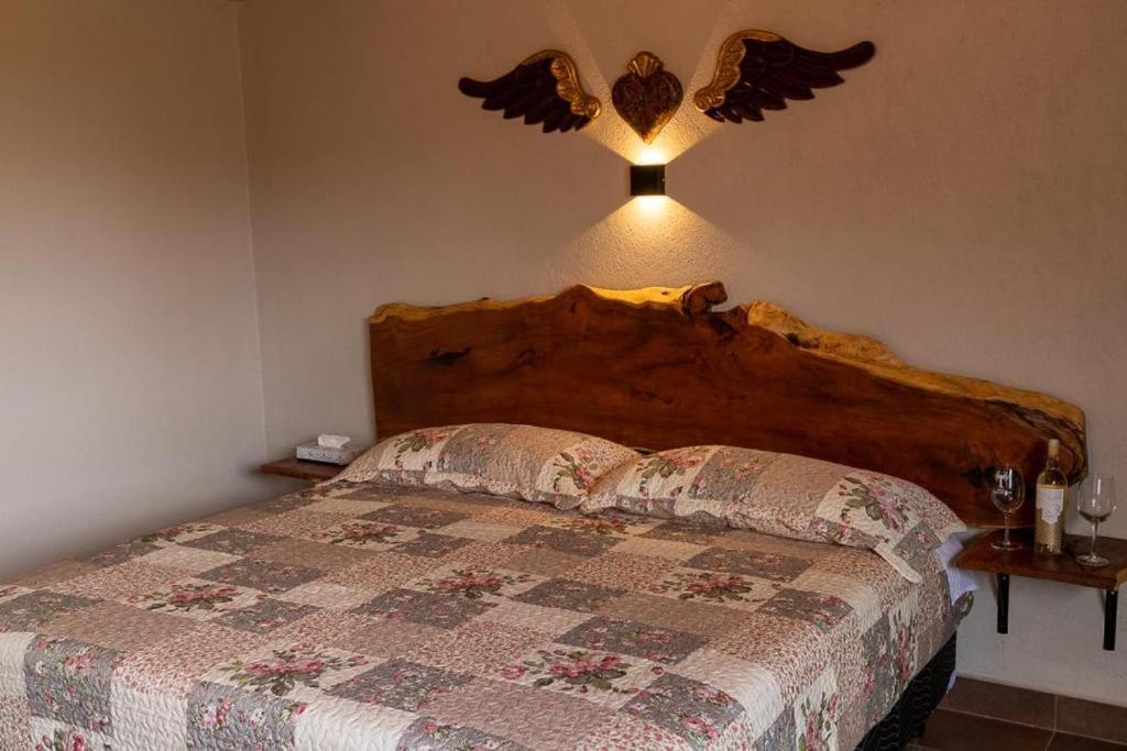 Postel nebo postele na pokoji v ubytování Hotel Viñedo los Arcángeles