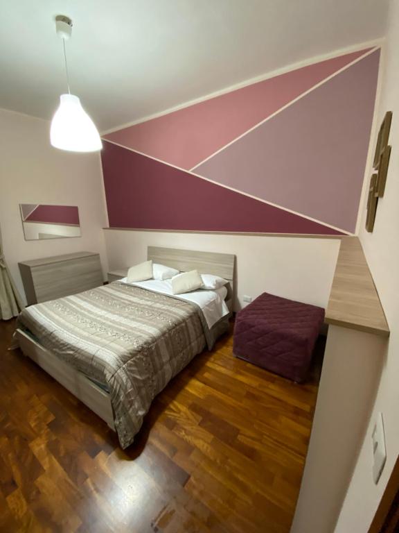 Postel nebo postele na pokoji v ubytování B&b Il miglio d’oro