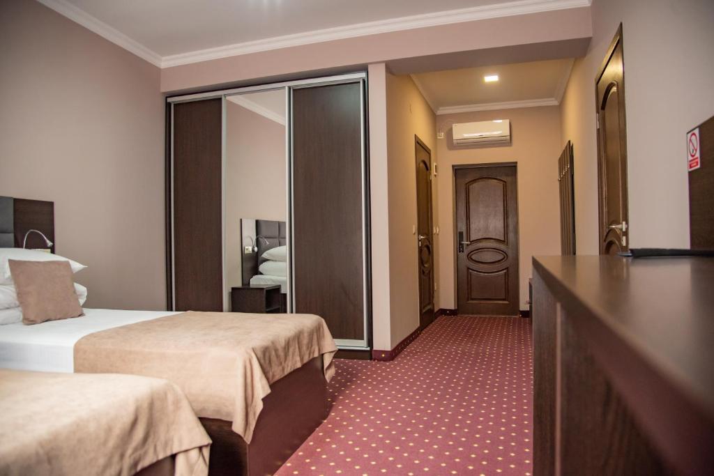 Postel nebo postele na pokoji v ubytování T&S Apart-Hotel