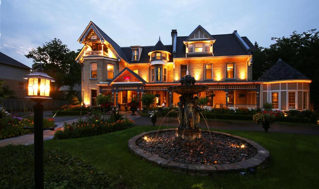 a large house with a fountain in front of it at The Idlewyld Inn and Spa in London