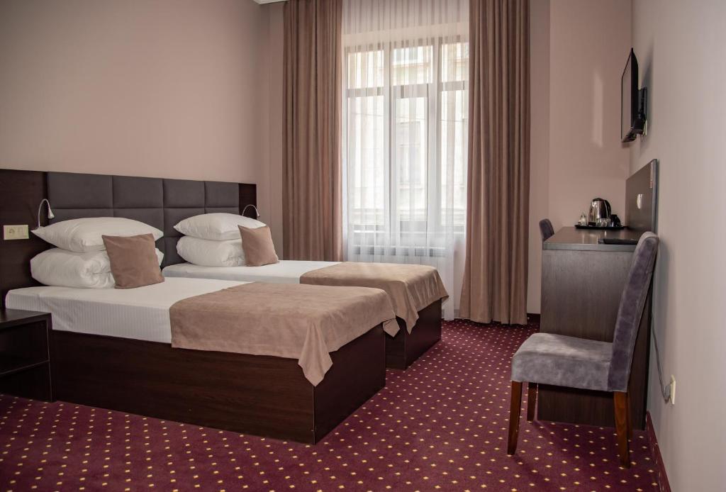 Postel nebo postele na pokoji v ubytování T&S Apart-Hotel