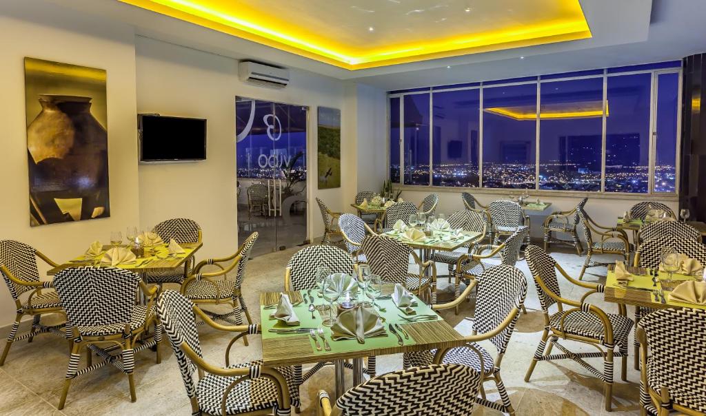 TV a/nebo společenská místnost v ubytování GHL Hotel Grand Villavicencio