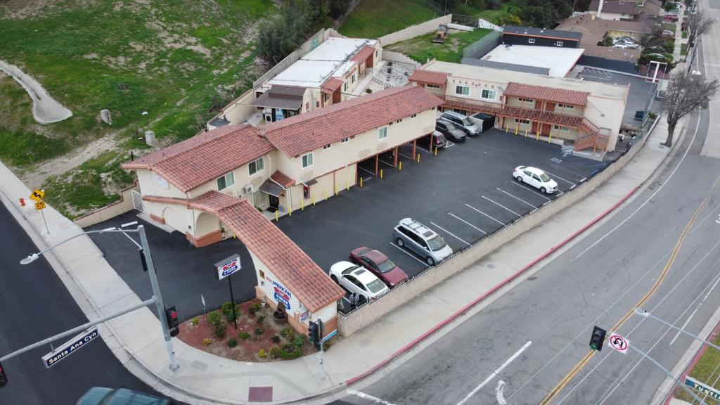 an overhead view of a building with a parking lot at New American Inn & Suites in Anaheim