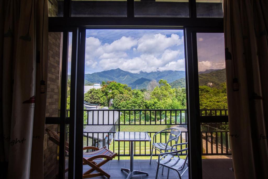 a view of a balcony with a table and chairs at Woolywo B&B in Yuli