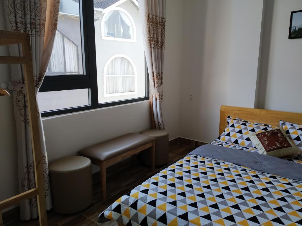 Postel nebo postele na pokoji v ubytování Gió Rừng GuestHouse Đà Lạt
