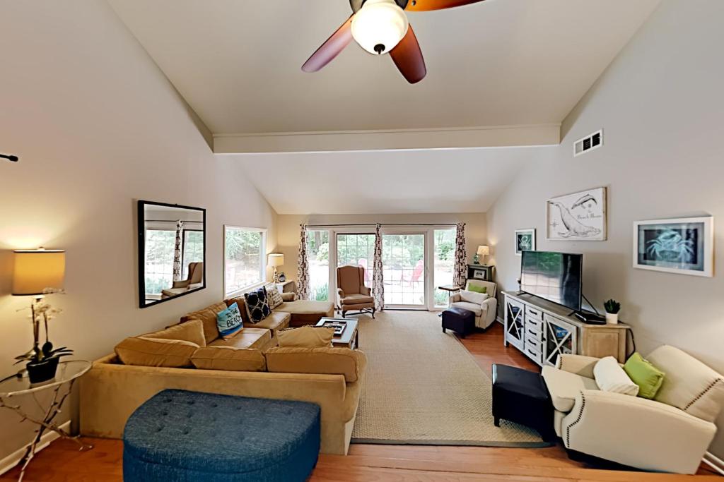 a living room with a couch and a ceiling fan at Pender Lane 13 in Hilton Head Island