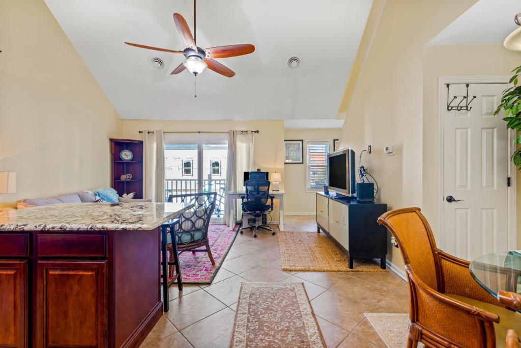 a kitchen and living room with a ceiling fan at Myrtle Beach Getaway in Myrtle Beach