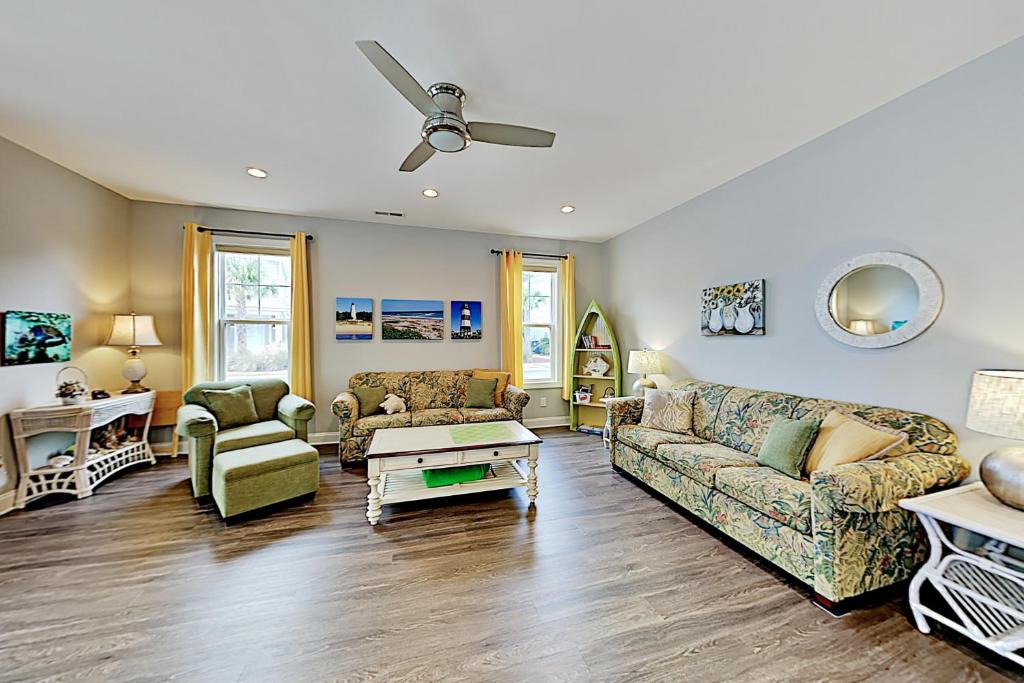 a living room with a couch and a table at The Retreat at Barefoot Village #41 in Myrtle Beach