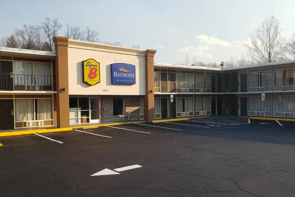 an empty parking lot in front of a hotel at Super 8 by Wyndham Morganton in Morganton