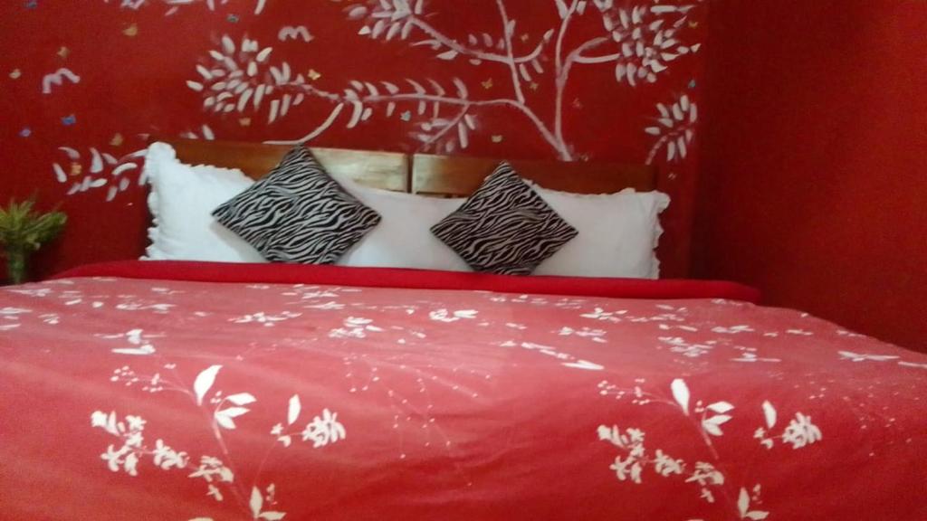 Postel nebo postele na pokoji v ubytování Secret Nest Homestay
