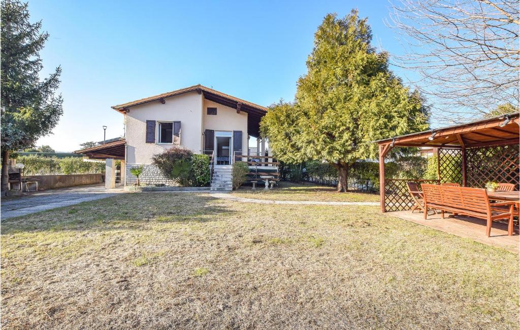 an image of a house with a bench at Lovely Home In Manerba Del Garda With Kitchen in Manerba del Garda