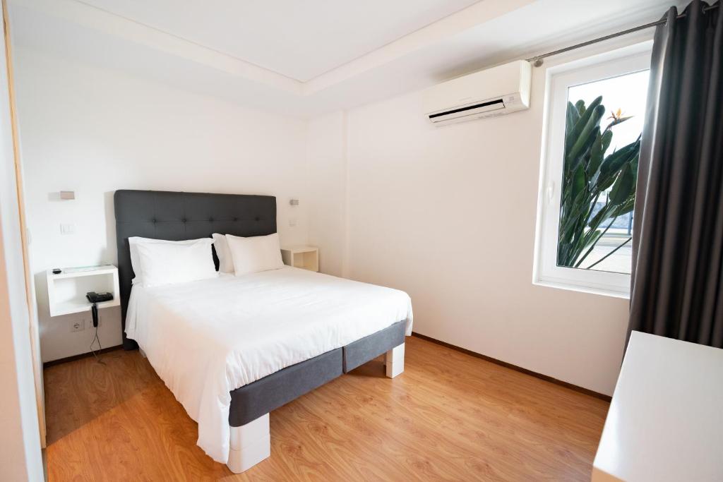 Postel nebo postele na pokoji v ubytování Hotel A Ponte