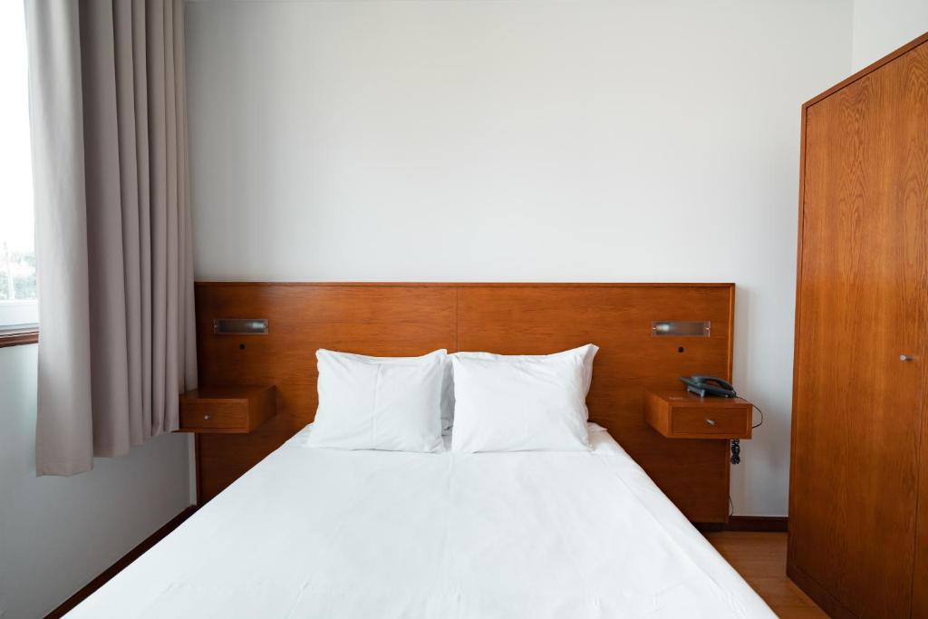 Postel nebo postele na pokoji v ubytování Hotel A Ponte