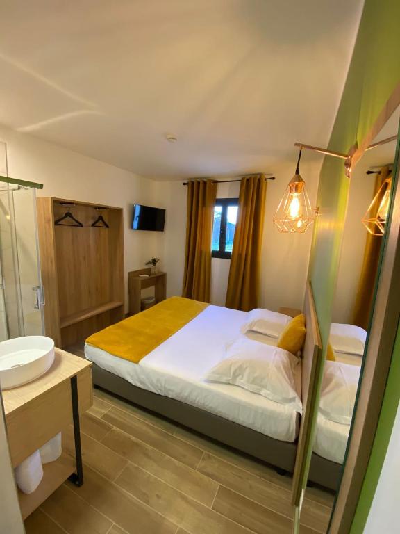Postel nebo postele na pokoji v ubytování Hotel U Catagnu