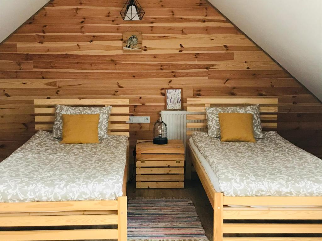 Postel nebo postele na pokoji v ubytování Wilcza Chata