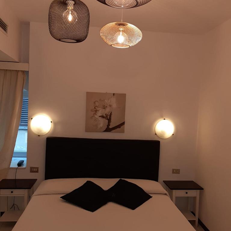 Postel nebo postele na pokoji v ubytování Hotel Victoria