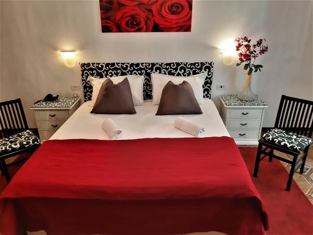 Postel nebo postele na pokoji v ubytování Hotel Victoria