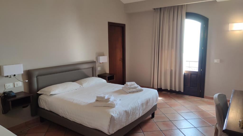 Postel nebo postele na pokoji v ubytování Airone Wellness Hotel