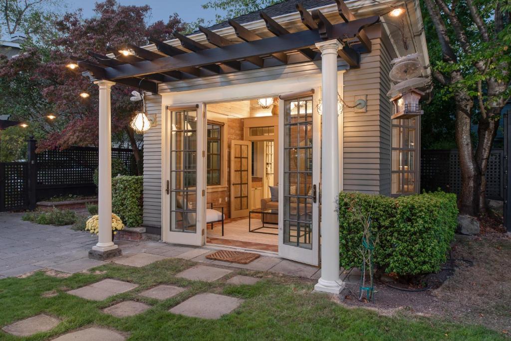 a pergola on a house with a patio at The Carriage House in Seattle
