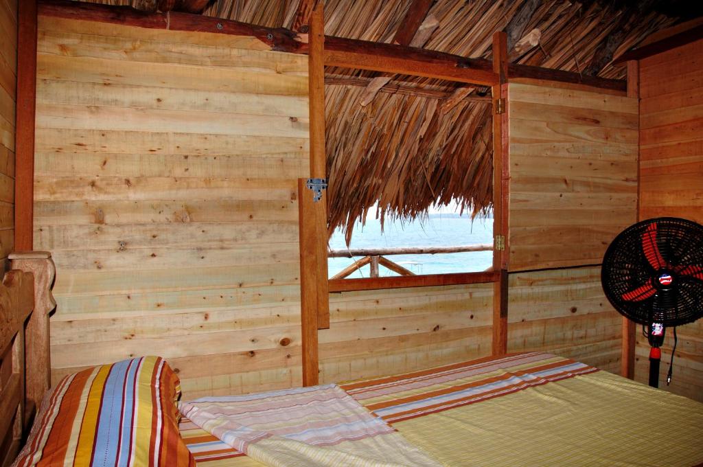 Voodi või voodid majutusasutuse Hostal Playa Blanca toas